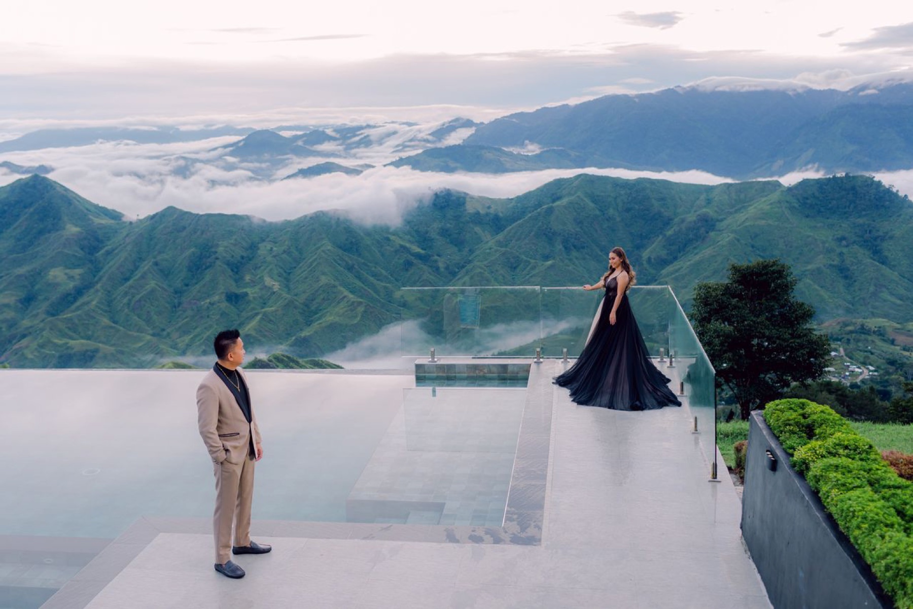 Couple photographed against a mountain landscape