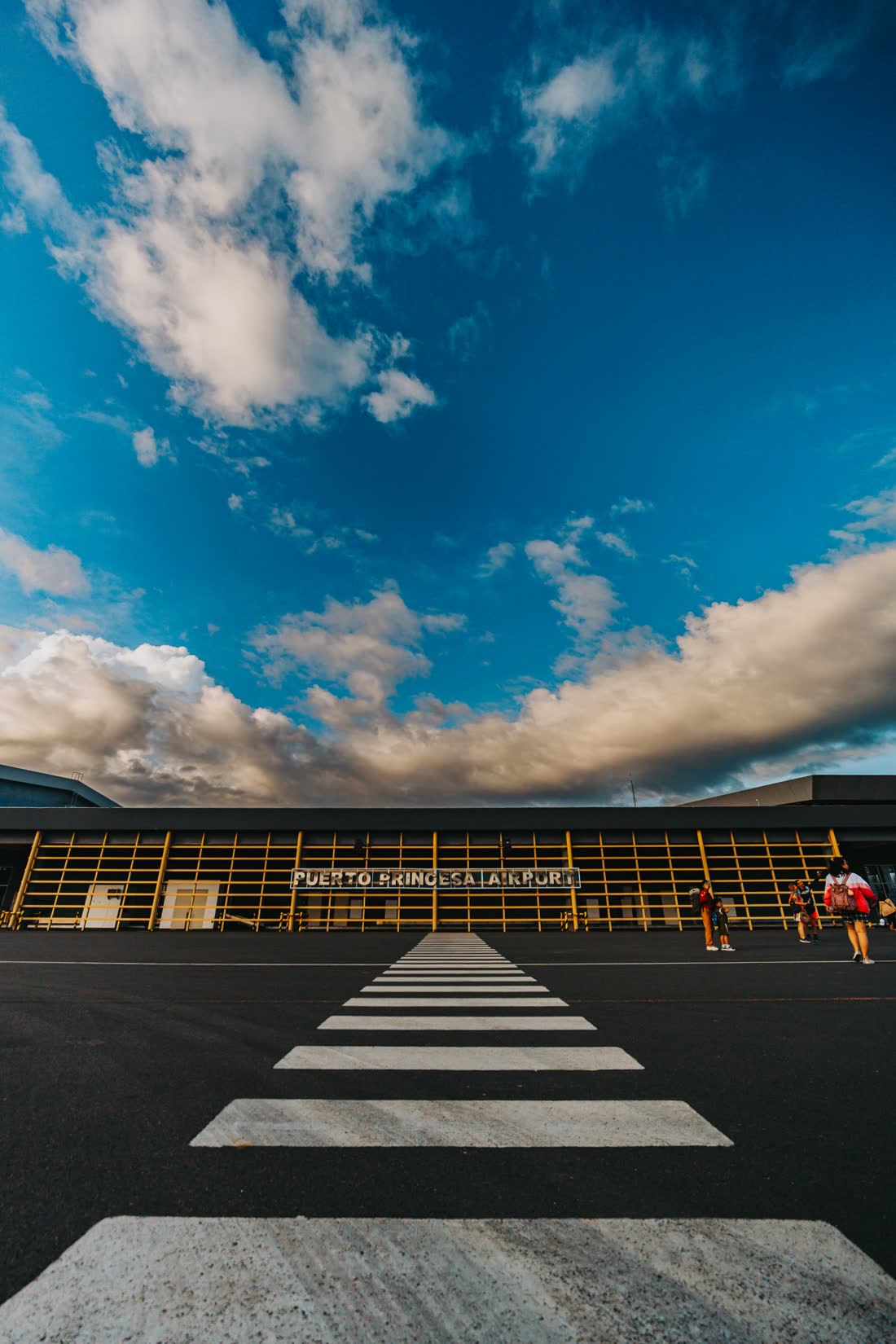 The terminal of Puerto Princesa International Airport under a wide blue sky