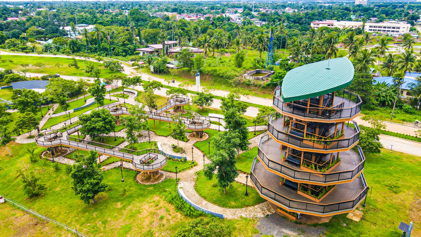 Aerial view of Balayong People's Park: winding paths and a round viewing tower among trees