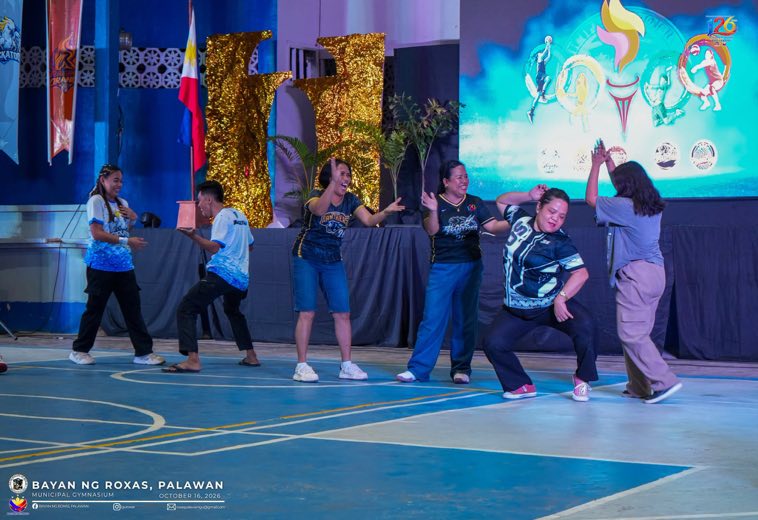 A dance group performing in the gym