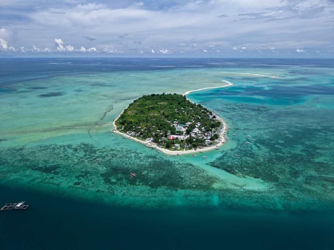 A small inhabited island ringed by reef