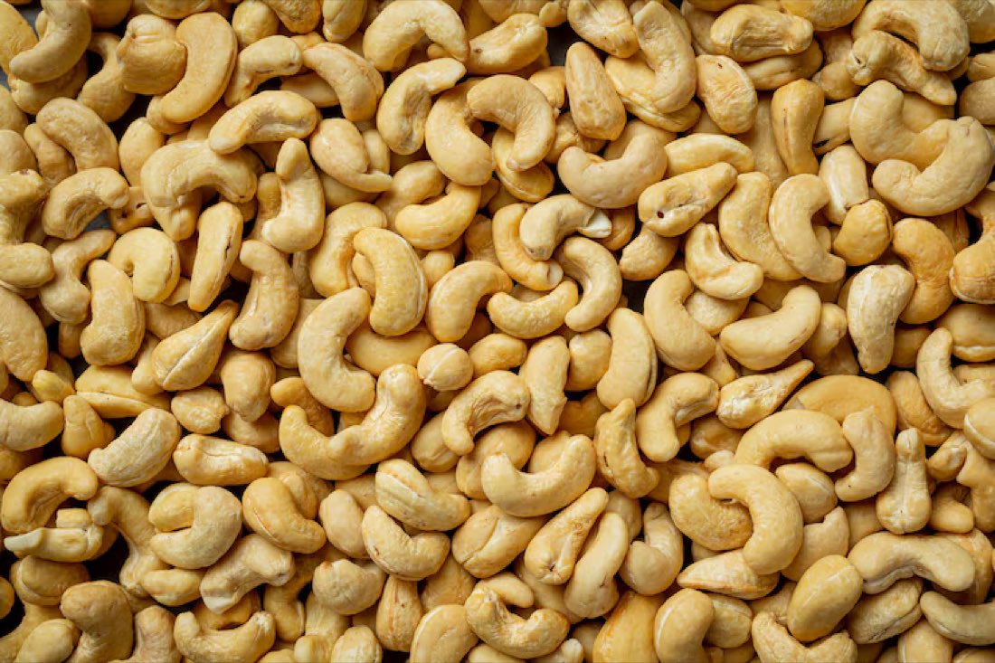 A close view of many whole cashew nuts
