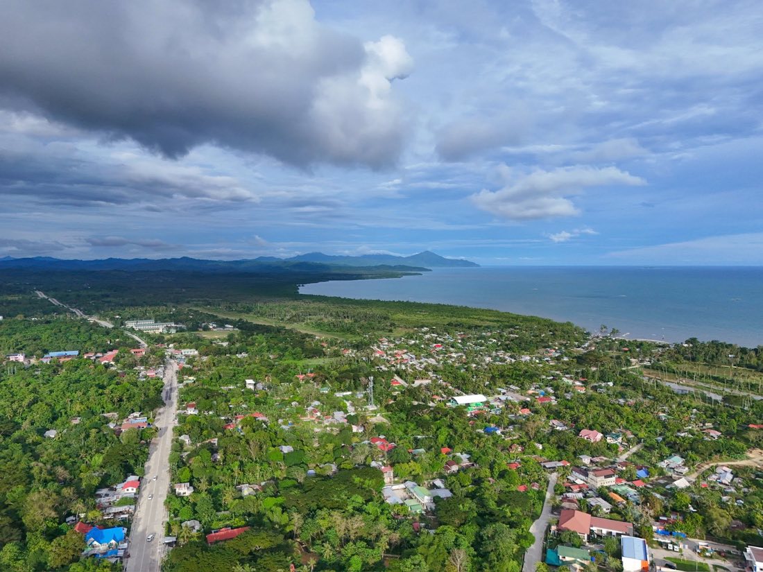 Aerial view of a road running through the town toward the sea