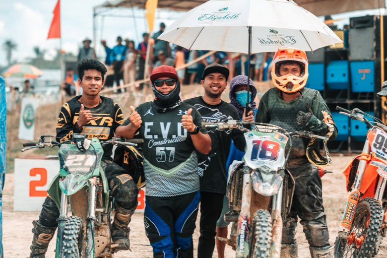 Motocross riders lined up at the start