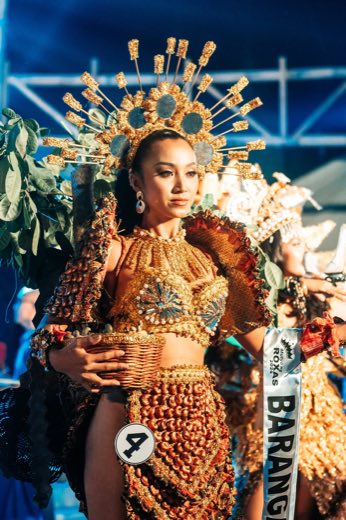 A pageant candidate in a jewelled gown
