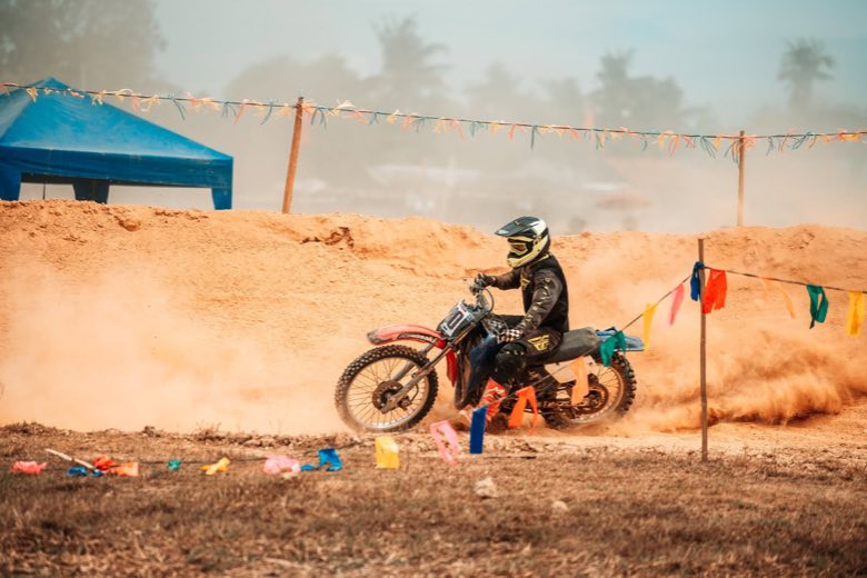A motocross rider in late-afternoon light