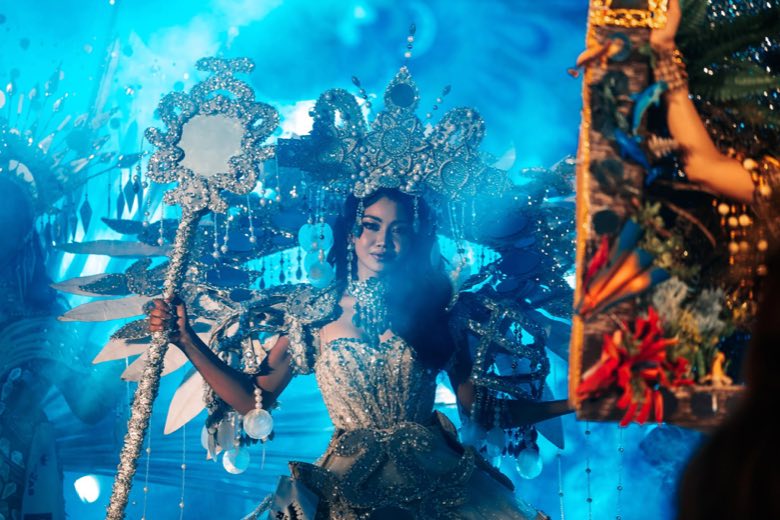 A performer under blue stage lights