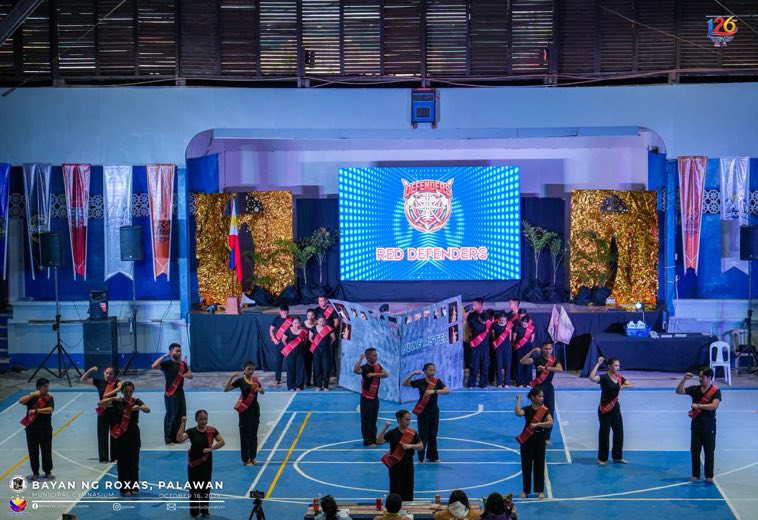 Performers on the gym stage