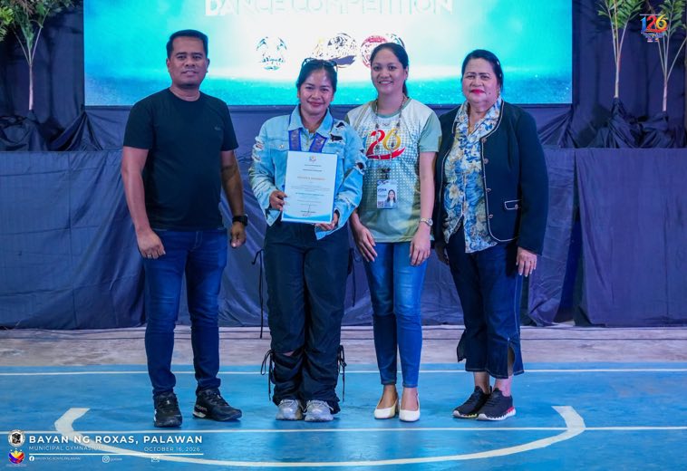 Officials holding a certificate on stage