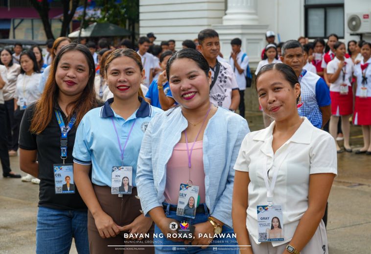 Young women in uniform smiling together