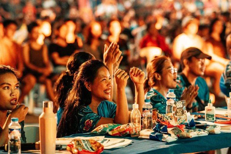 A crowd watching a show at night
