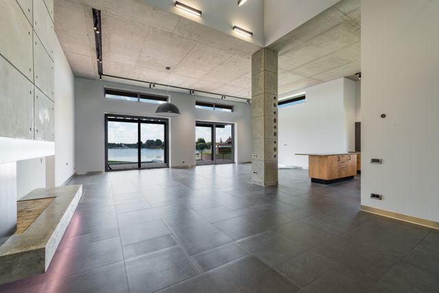 A bright, open office room with large windows